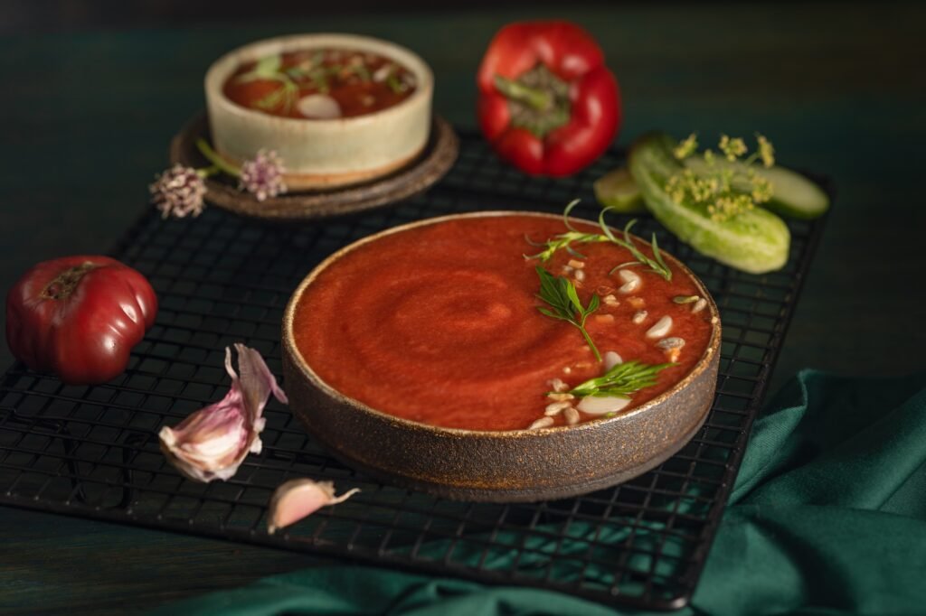 A bowl of Spanish traditional cold tomato and cucumber gazpacho soup.